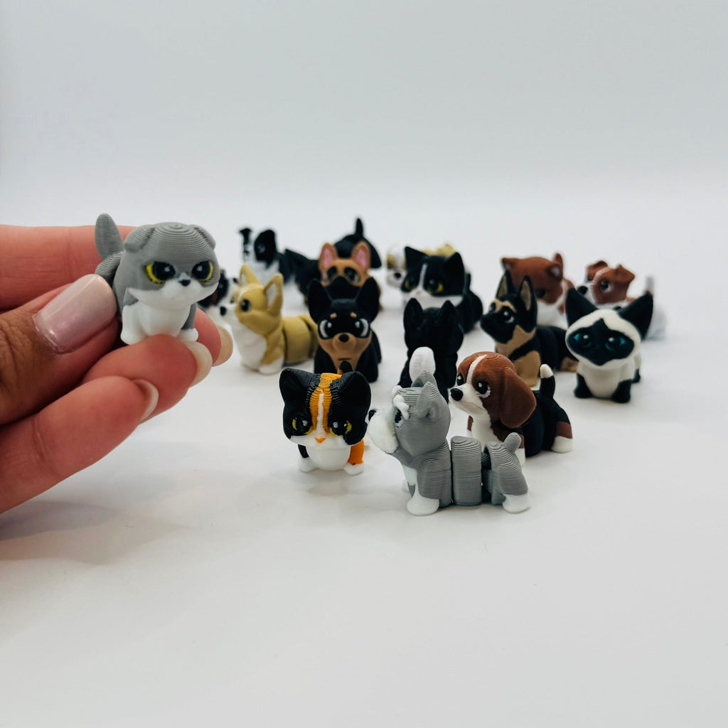 Bubzo figures held in a hand, showing the size